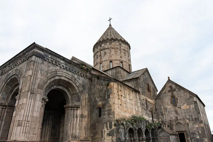 Close-up of the stone architecture and dome of Tatev Monastery.